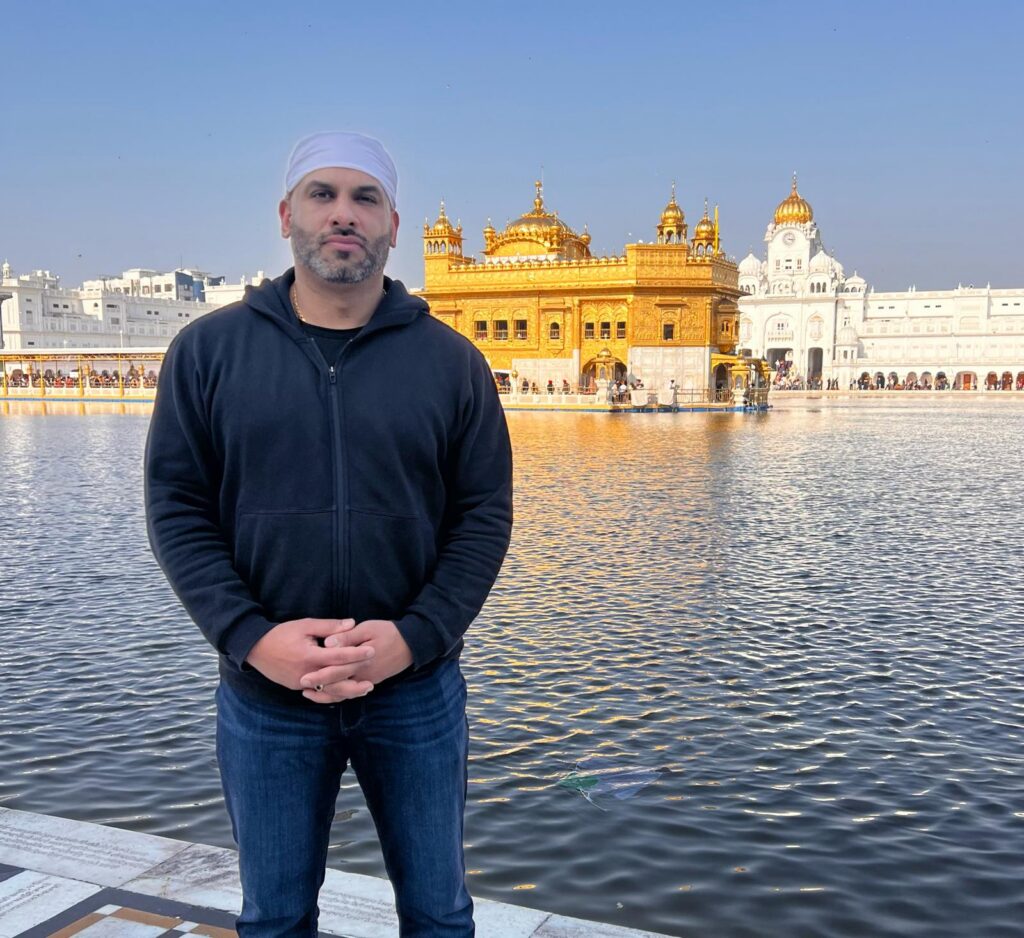 Dave Sidhu standing in front of Golden Temple
