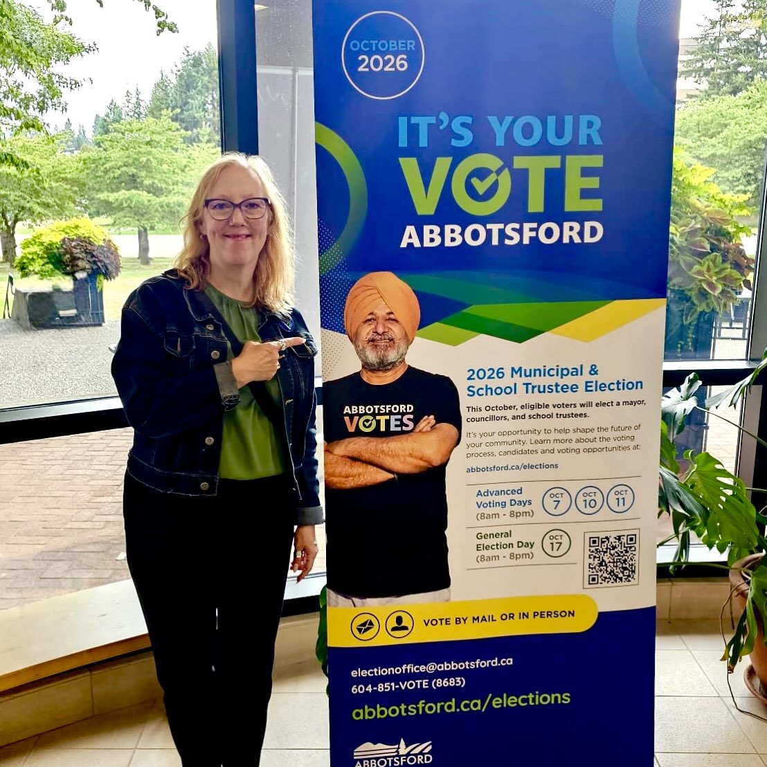 Shirley Wilson in front of 'It's your Vote' AD baner